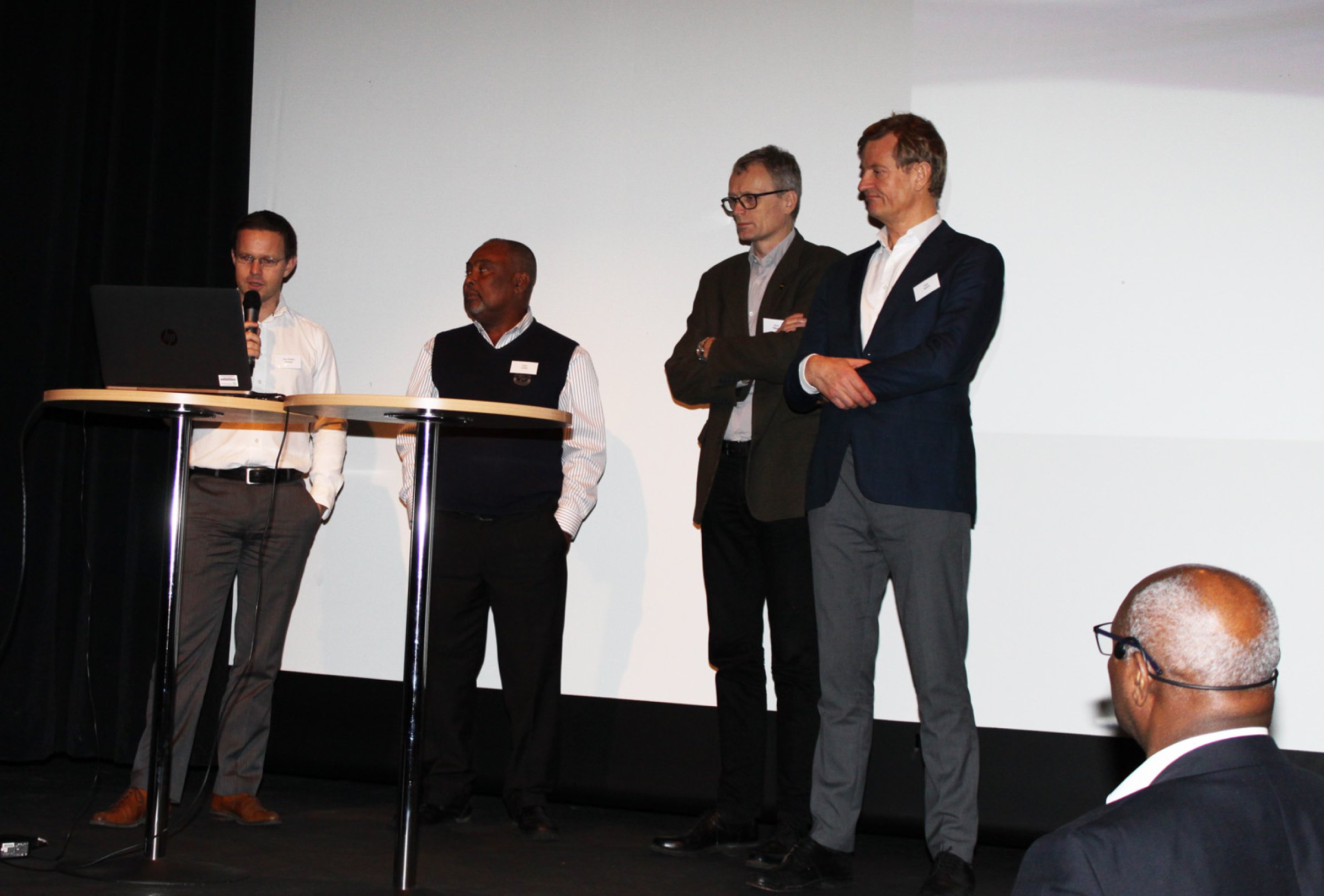 Paneldebate led by Dr Kofitsyo Cudjoe (front right seen from behind)  From left: Executive of Sensacon Iver Kristian Arnesen, The Director of Fish Health from Ghana’s Fishery Commission, Dr Peter Ziddah, Deputy Director of Fish Health at the Norwegian Veterinary Institute, Dr Arne Flåøyen and Consultant from the Advisory office of NORAD and NORFUND, Mr Peter Molthe.